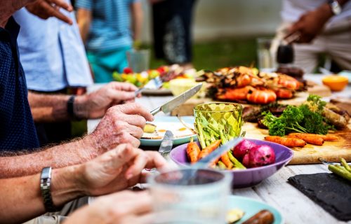 Closeup of diverse people enjoying barbecue party together